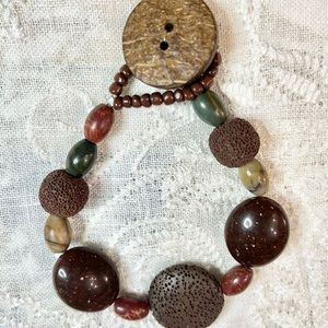 9” boho bracelet. Lava stone, acrylic, glass, and wood beads. Fun to layer
